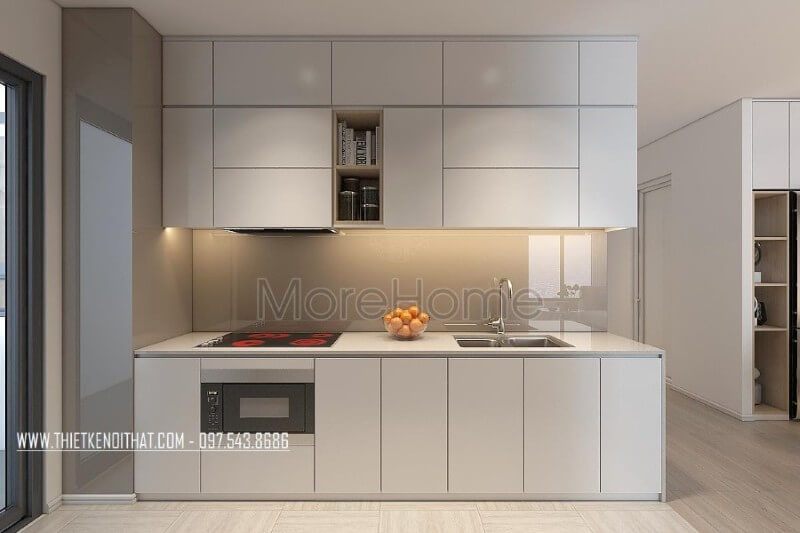 Mẫu tủ bếp kiểu dáng chữ i gỗ công nghiệp màu trắng kết hợp phân chia các ngăn tủ một cách hợp lí, tạo cho người nội trợ thuận tiện hơn trong quá trình mang lại những bữa cơm ngon miệng cho những người thân yêu của mình Tủ bếp chung cư